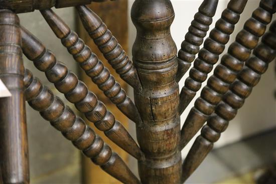 A 19th century turners chair, with triangular seat and ball-turned spars to back